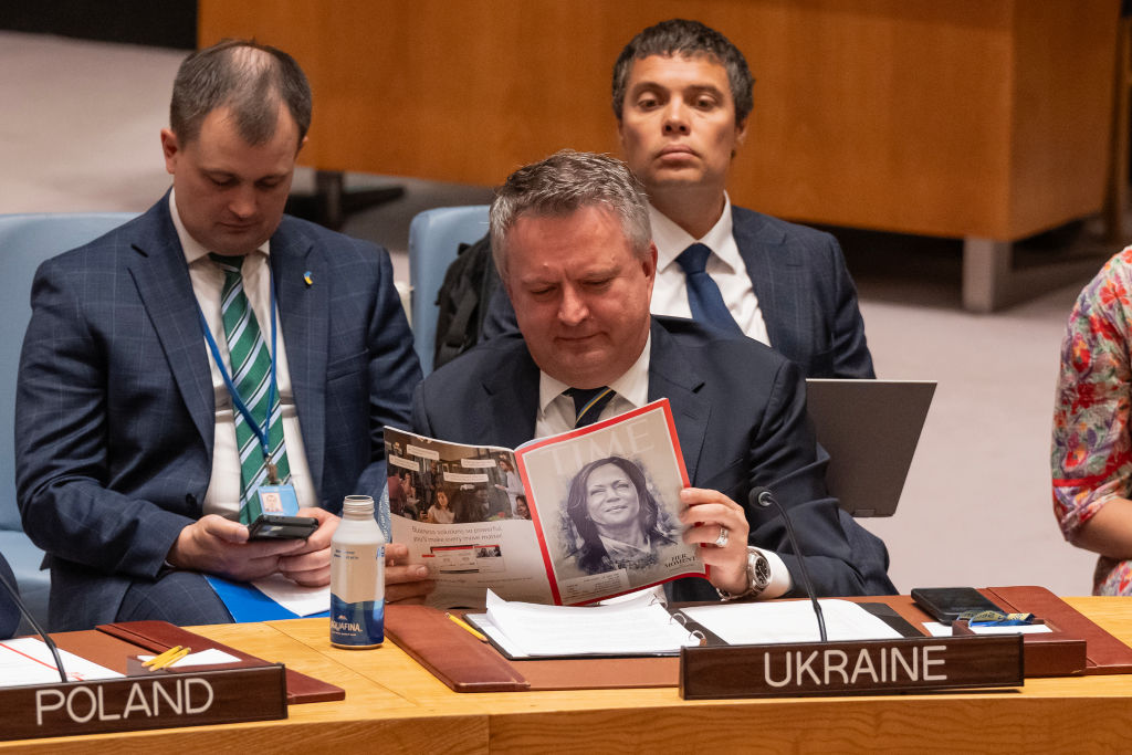 Ambassador Sergiy Kyslytsya of Ukraine reads Time magazine...