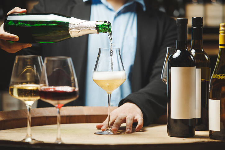 Sommelier Conducting Wine Tasting with Sparkling Wine