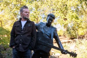 Rock star and singer-songwriter John Mellencamp stands next...