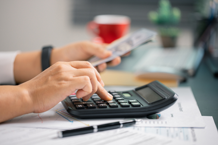 Person manage finances wisely, saving cash from their salary to ensure stable income for future payments and business investments. currency, money, saving, cash, hand, finance, financial, income.
