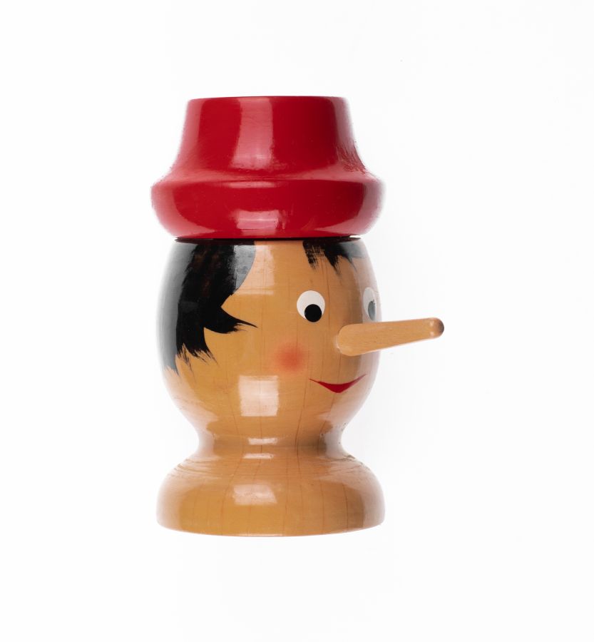 wooden head of Pinocchio isolated on white background