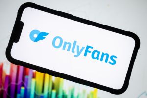 In this photo illustration, an Only Fans logo seen displayed...