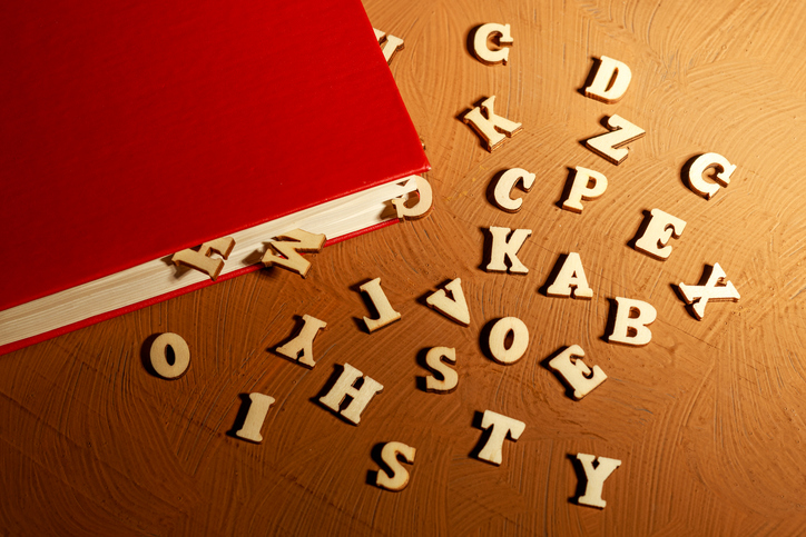The letters spilled out of the red book. a closed book