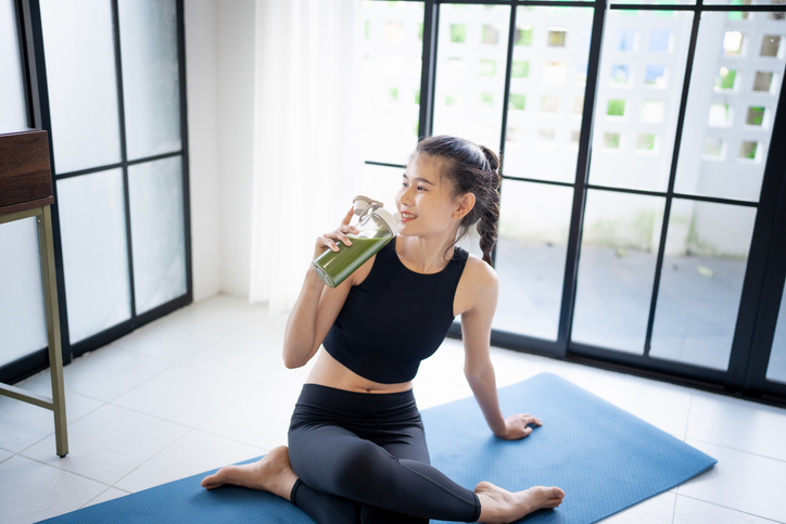 Sporty asian woman in sportswear drink healthy drink from bottle After Exercise for Energy Vitality After Exercise for Energy wellness health sportswoman wellness health
