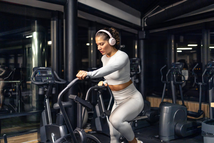 Training on bicycle in the gym.