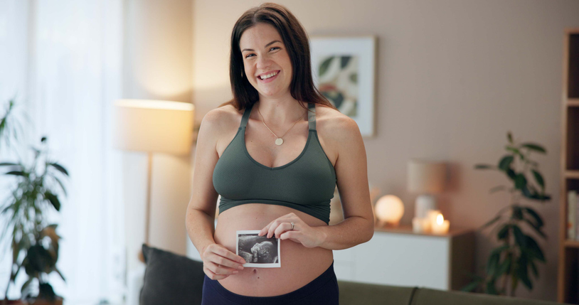 Pregnant woman, sonogram and portrait in home for baby development, growth or update. Happy, maternity picture and future mother with fetal ultrasound for prenatal health, IVF results and motherhood