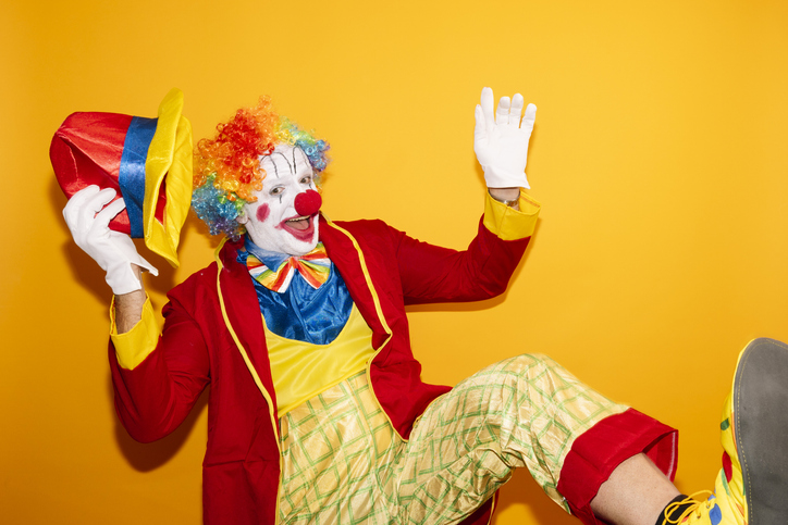 Smiling clown making gestures, funny.