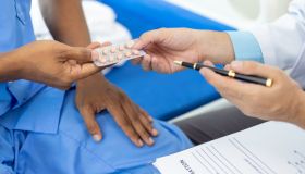 Doctor gives medication advice to a male patient with symptoms of sexual dysfunction, Male health problems. Health consultants and disease treatment from specialized doctors in the hospital.