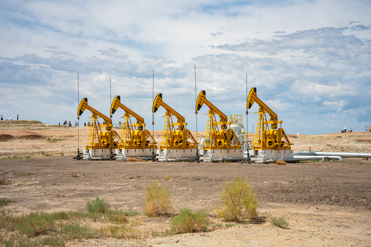 A couple of oil pumps in front of a clean sky would be ideal for a copy space.