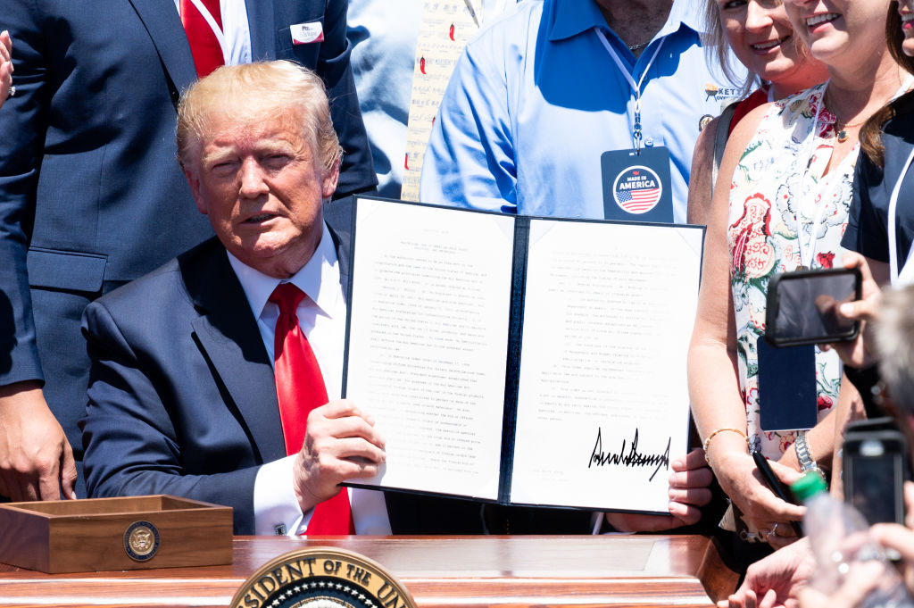President Donald Trump signing an Executive Order on...