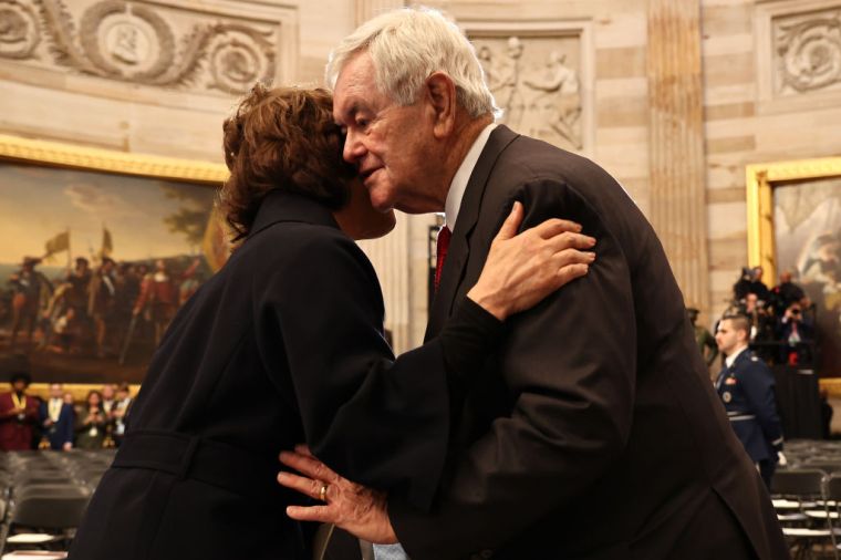 Former U.S. Speaker of the House Newt Gingrich (R) greets former U.S. Secretary of Transportation Elaine Chao as they arrive to the inauguration