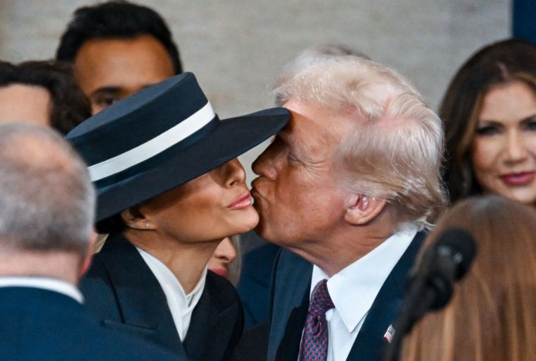 President-elect Donald J. Trump kisses Melania Trump during the inauguration.
