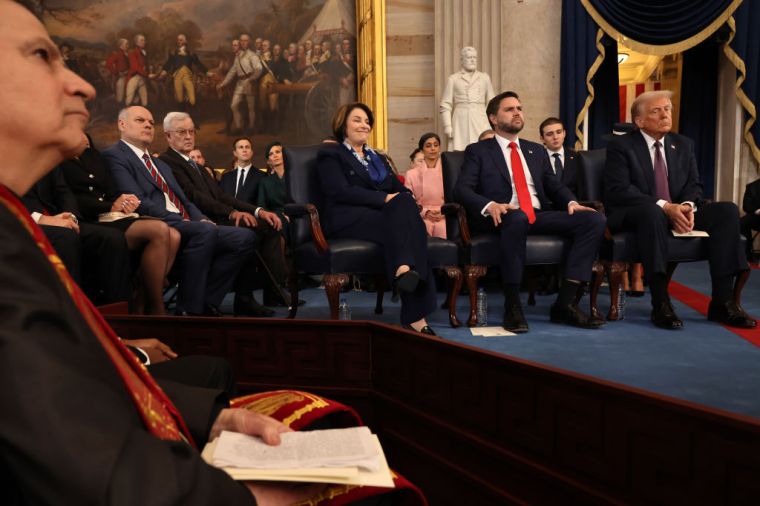 Sen. Amy Klobuchar (D-MN), U.S. Vice President-elect former Sen. J.D. Vance (R-OH) and U.S. President-elect Donald Trump look on during inauguration