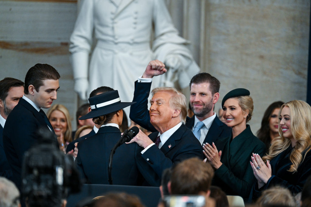 U.S. President Donald Trump celebrates with family after being sworn in at his inauguration