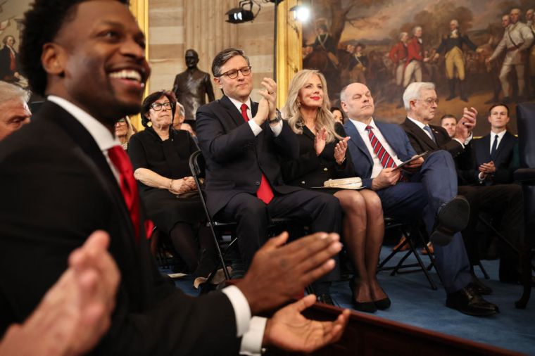 House Mike Johnson (R-LA) and his wife, Kelly Johnson, react as US President Donald Trump speaks during inauguration