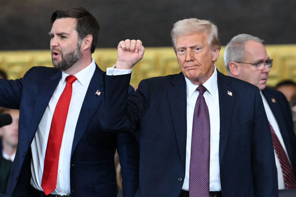 US President Donald Trump raises his fist at the conclusion of the inauguration