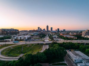 City of Indianapolis Skyline with a large Infiltration Basin / Bioswale along U.S. Interstate 70 to collect stormwater from the roadway