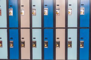 Colorful Secure Lockers with Padlocks in a Row at an Institution