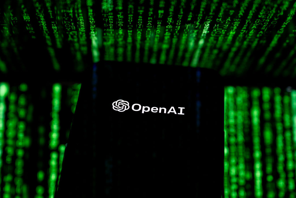 In this photo illustration, the OpenAI logo seen displayed...