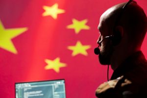 Chinese engineer making bot accounts spreading viruses on internet, close up