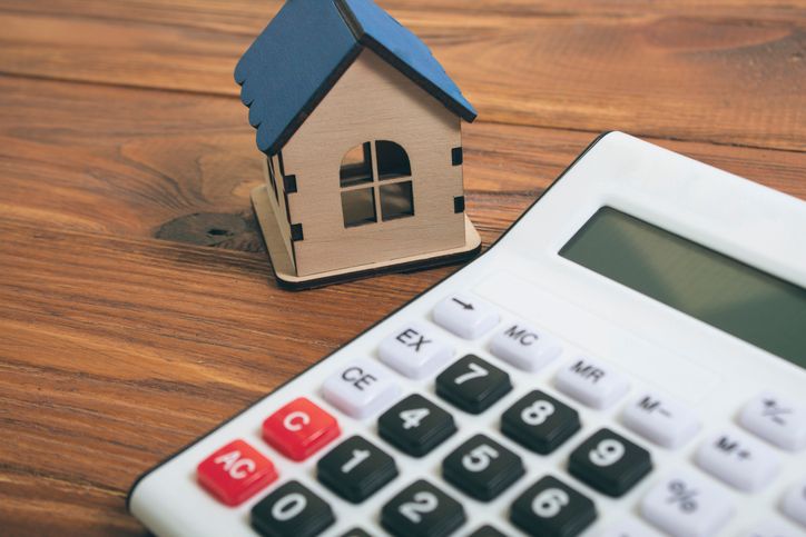 a house and a calculator on the table