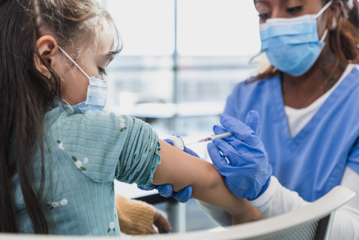 Healthcare Worker Administering Vaccine to Child