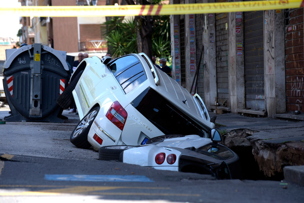 Two cars sunk in a chasm that opened in via Zenodossio in...