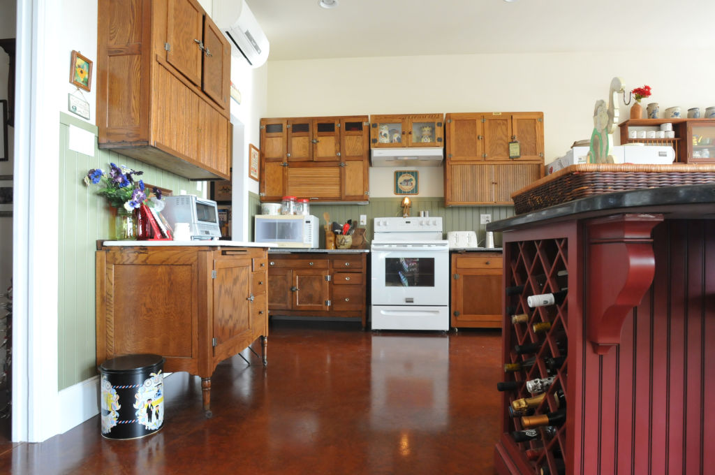 Floor Plans Jo and Kurt Reinhart, 715 Schappell Road, Hamburg. Photo by Bill Uhrich 12/22/2014 509 û The Reinharts used three oak Hoosier cabinets, separating the top and bottom portions, instead of traditional kitchen cabinets and counter tops.