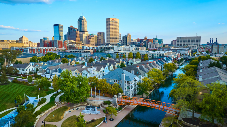 Aerial of Indianapolis Skyline with Canal and Pedestrian Bridge at Golden Hour