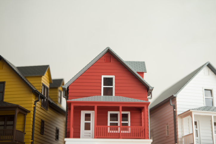Row of single family homes model construction exterior with white background copy sapce.