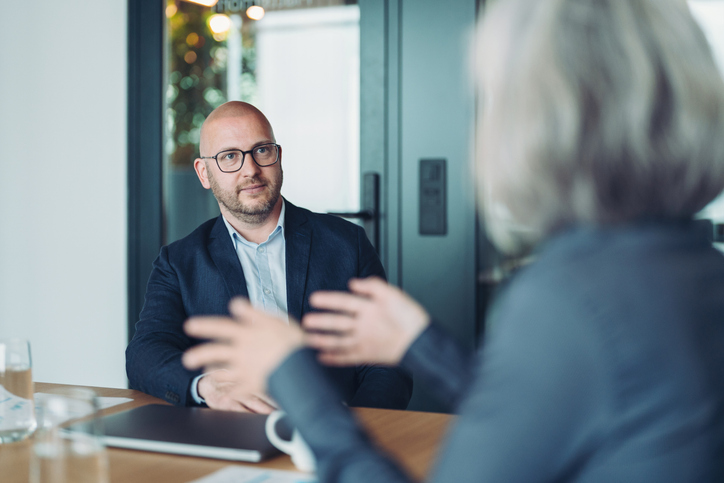 Businessman listening carefully to a colleague