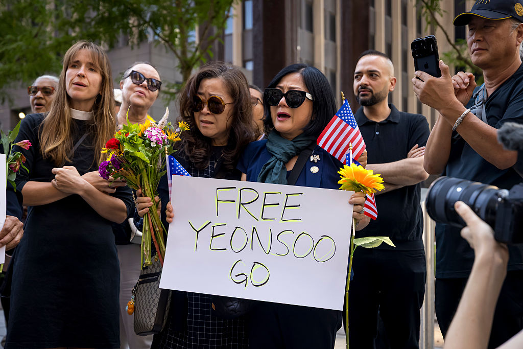 Faith leaders and activists gather outside the Jacob K.