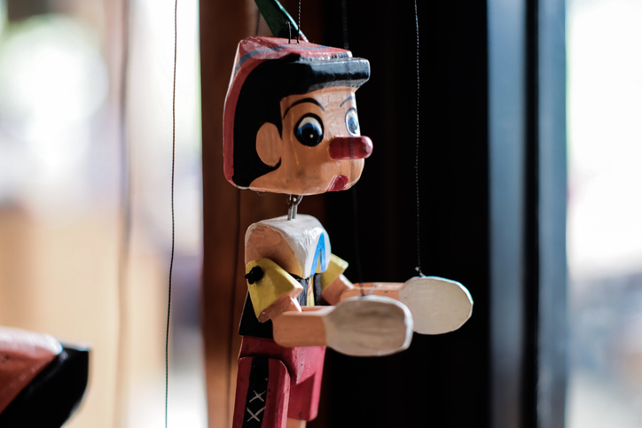 Close-Up Of Toy Hanging On Window