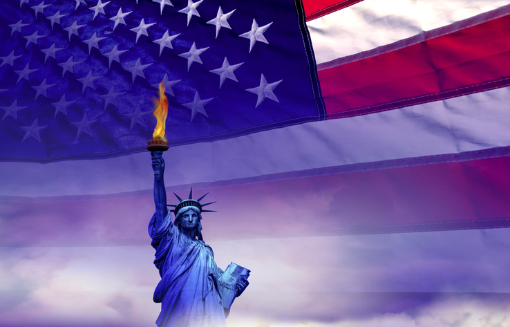 Statue of Liberty with burning torch and American flag, Freedom and equal opportunity concept