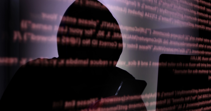 Cyber crime, malware hacker, red computer coding overlay. Hooded silhouette man.