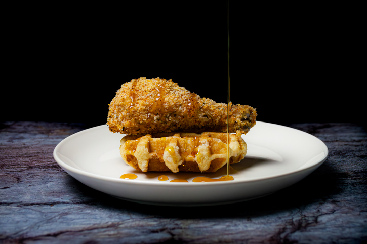 Chicken and Waffles with Honey Drizzled Over the Top