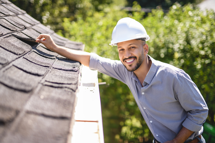 Arab islamic man with hard hat to roof inspector
