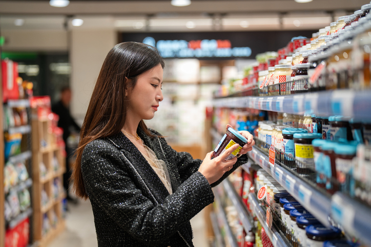 Asian young woman shopping in supermarket