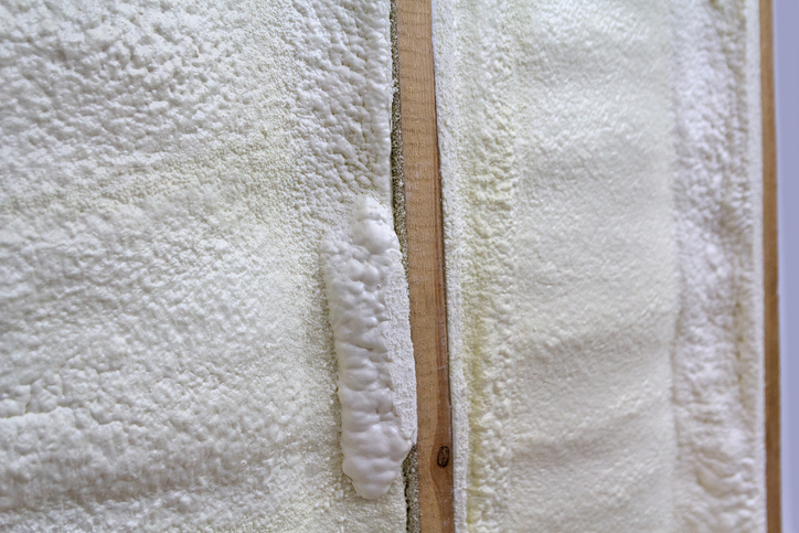 Polyurethane foam insulation between wall studs texture
