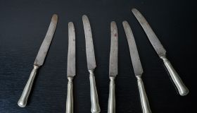 rusty silverware knife and fork on black furniture