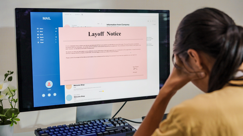 Frustrated fired woman reading bad news in pink slip e-mail letter from laptop at home, Company got serious financial problems because economic recession,corporate downsizing ,she was laid off quitting job Unemployment concept