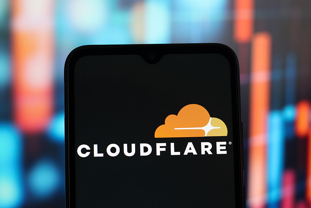 In this photo illustration, the Cloudflare logo is seen...