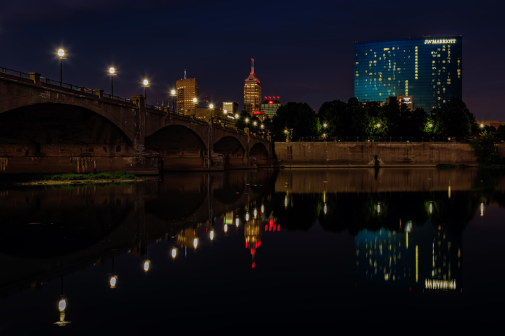 Indianapolis Skyline and White River Bridge at Night - Indianapolis, Indiana, USA.