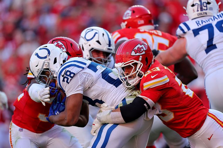 Jonathan Taylor #28 of the Indianapolis Colts is tackled