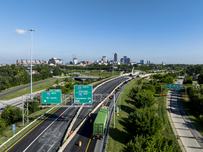 Early morning aerial of Interstate 65 and 70 Interchange - Flyover Ramps and Overhead Highway Signs - Downtown Indianapolis, Indiana