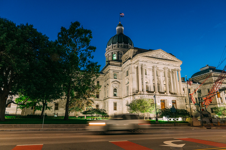 Long Exposure of a Car passing on Capitol Ave at the Indiana State Capitol building in Indianapolis, Indiana