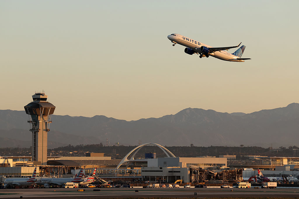 Americans Are Cutting Spending to Keep Traveling, Survey Finds