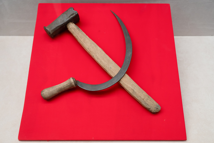 Hammer and sickle on a red background . Concept of communism, political symbolism, history, propaganda, and revolutionary movements.