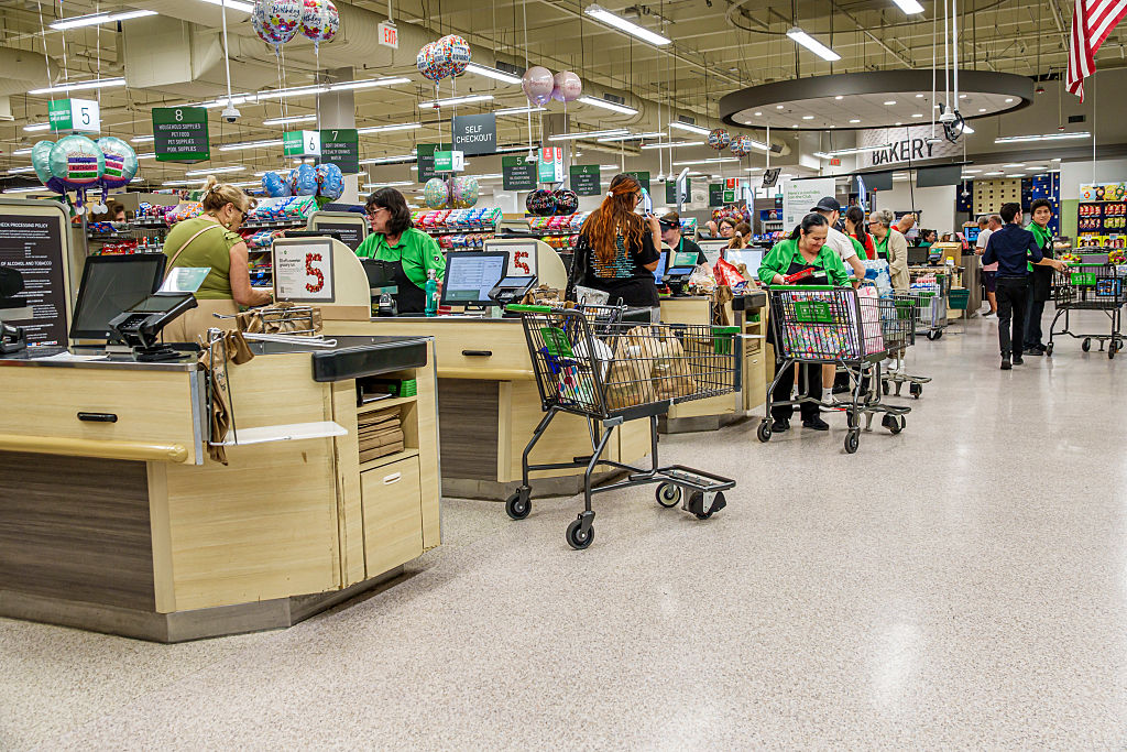 Employees and customers at the checkout counter section inside Publix grocery store, North Beach, Miami Beach, Florida.