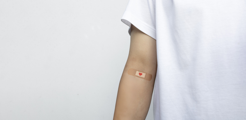 Blood Donation Bandage on Donor Arm After Voluntary Blood Transfusion Procedure